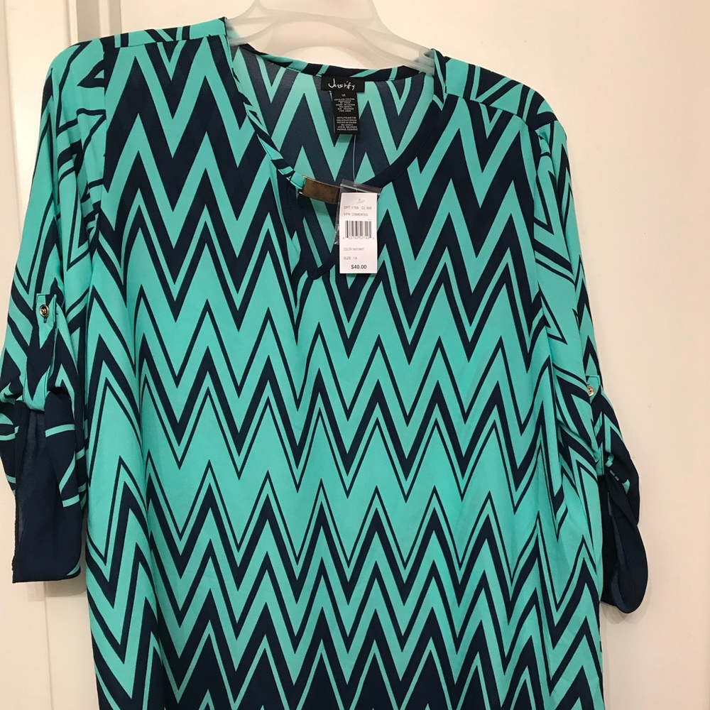 Polyester top never worn still has tags.